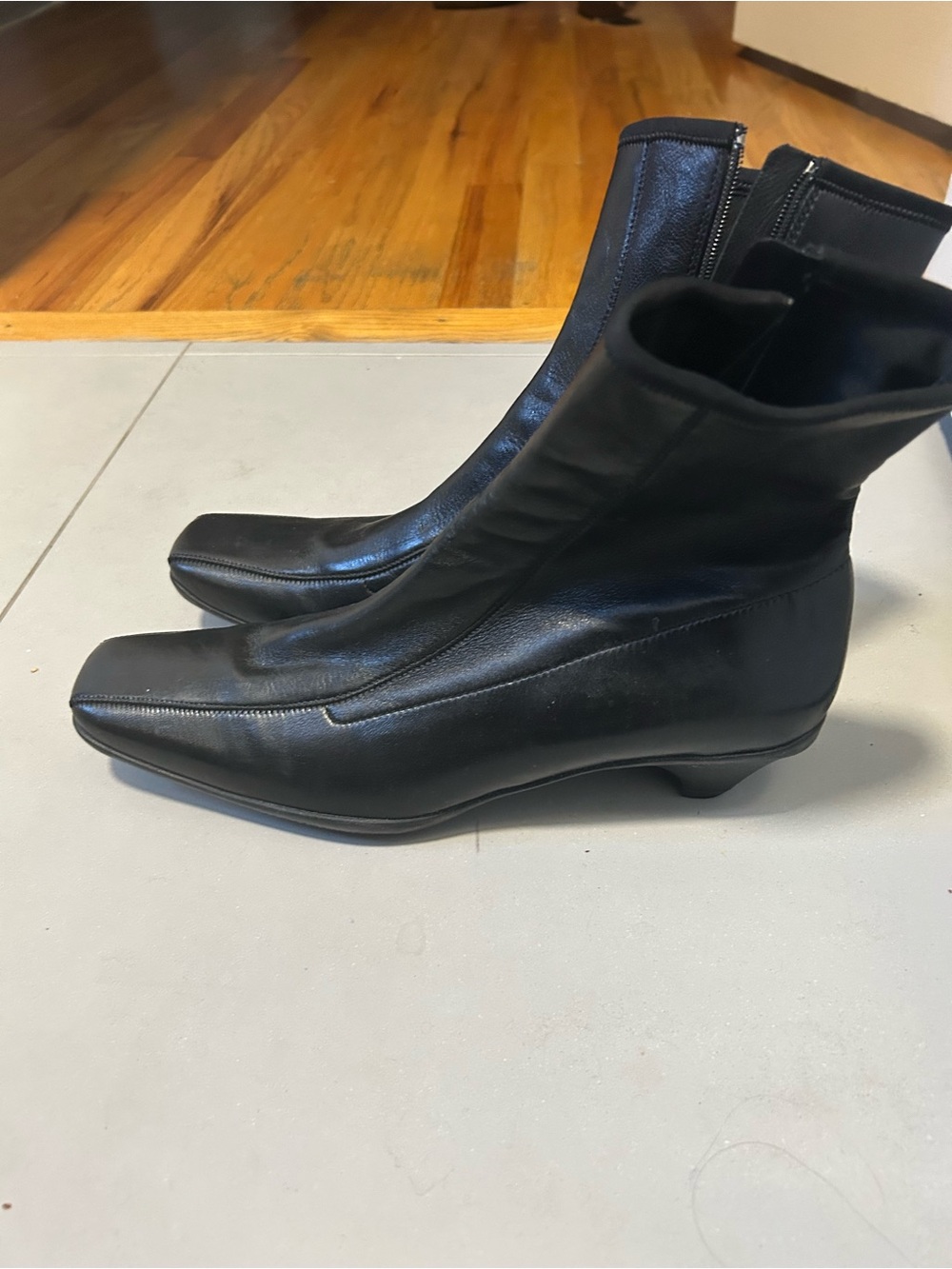Prada Women's Black Leather Ankle Boots - Sleek Zip Closure